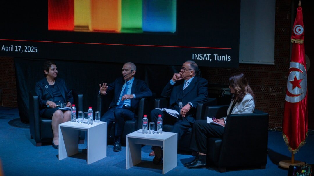 Panel discussion with multiple speakers at a table